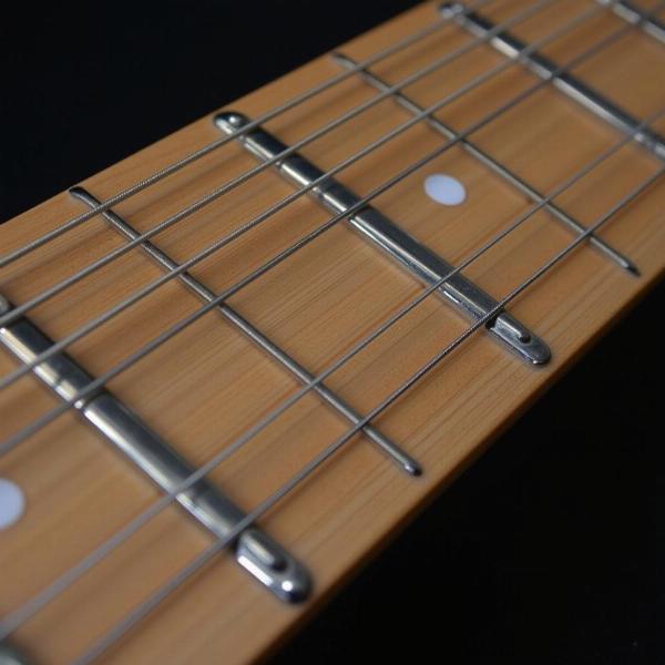 Close-up of guitar frets