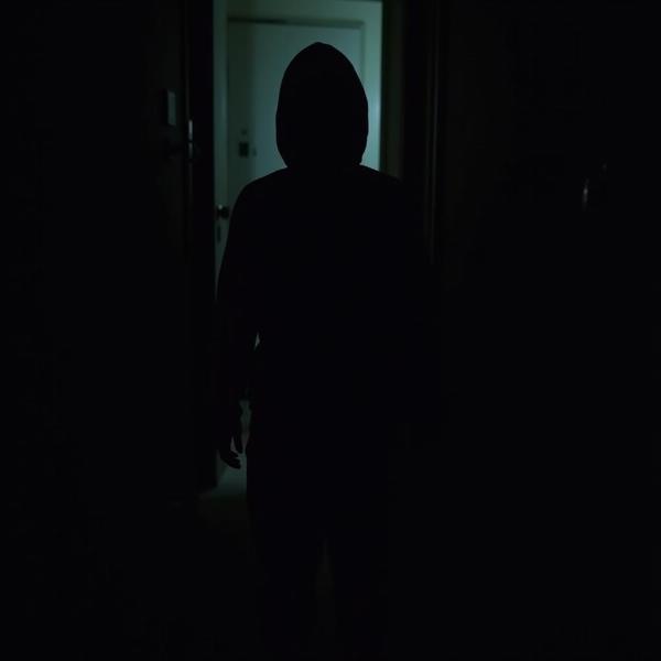 A mysterious figure in the shadows